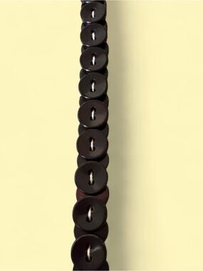 Black vintage handmade stacked button necklace hangs 15”